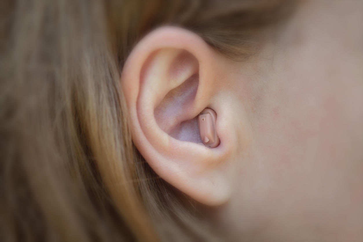 Woman having hearing aid test